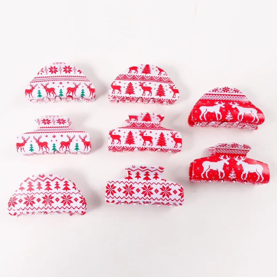 Christmas updo hair clip with snowflake and reindeer details